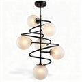 Modern pendant light fixture with five frosted glass globes and brass finish